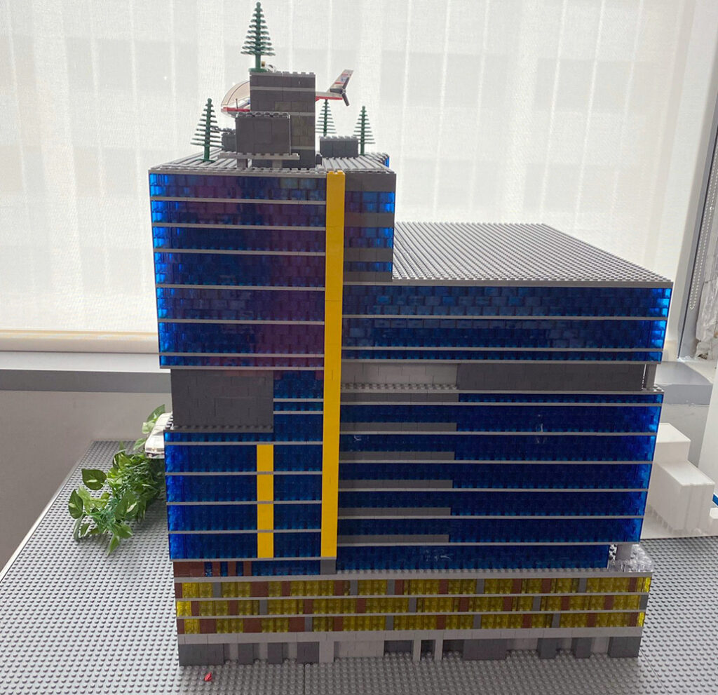 View of a Engineer and worker watching blueprint on construction site