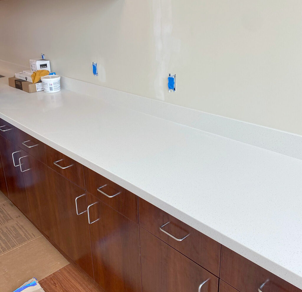 View of a Engineer and worker watching blueprint on construction site